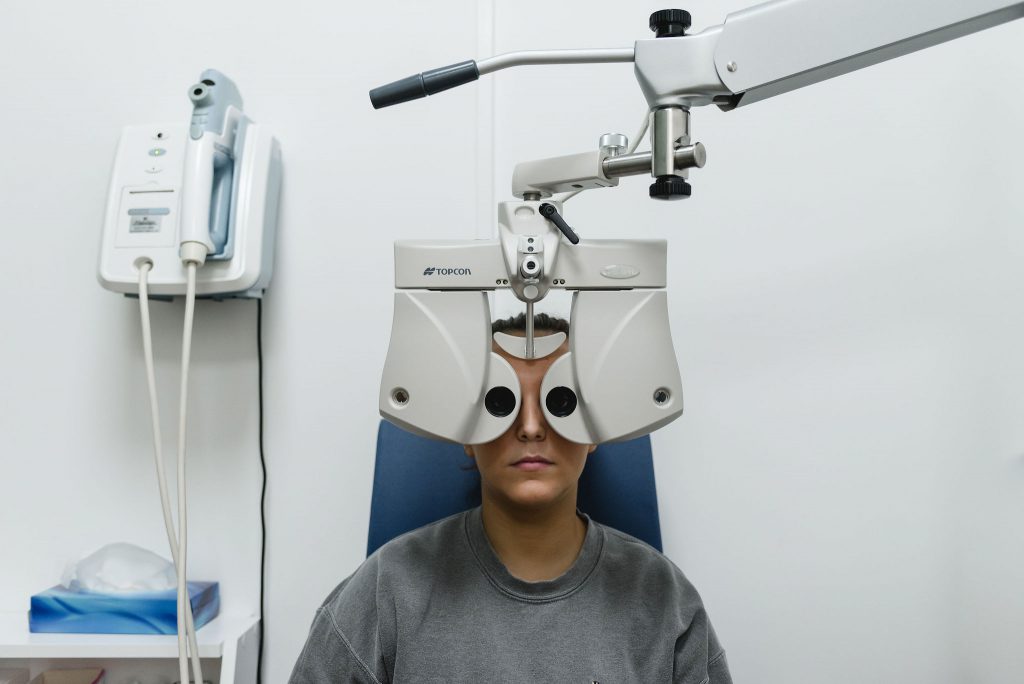 A young woman undergoing a sight test